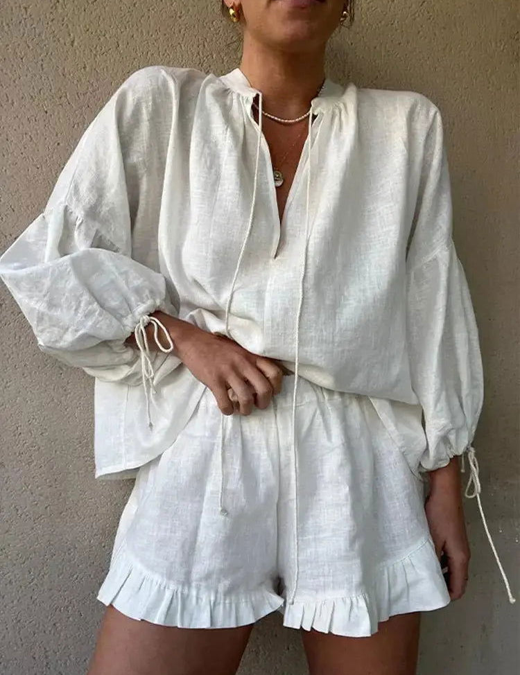 Completo invernale chic di camicetta con scollo a V e pantaloni con volant di ZARA